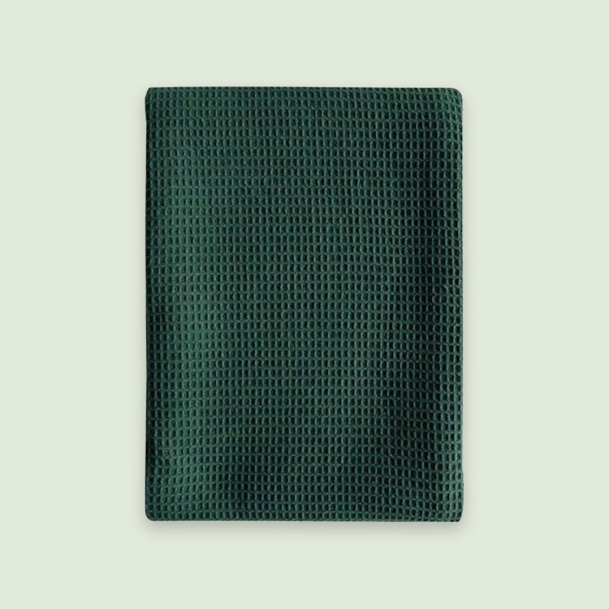 A dark green textured mesh pouch or sleeve with a waffle-like pattern, shown flat against a light off-white background.