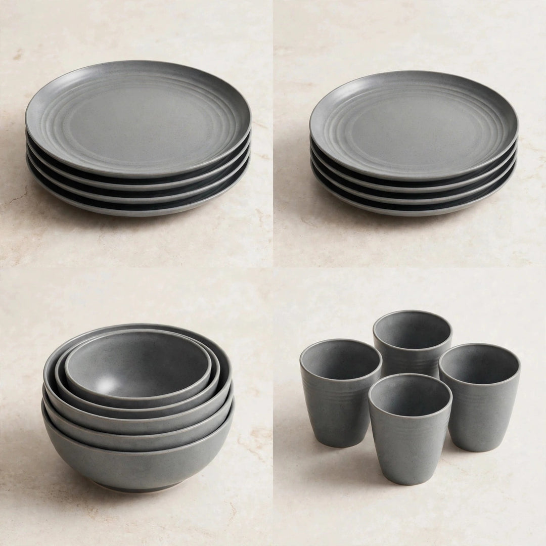 Four stacked groups of grey dinnerware showing plates, bowls, and cups on a beige surface.