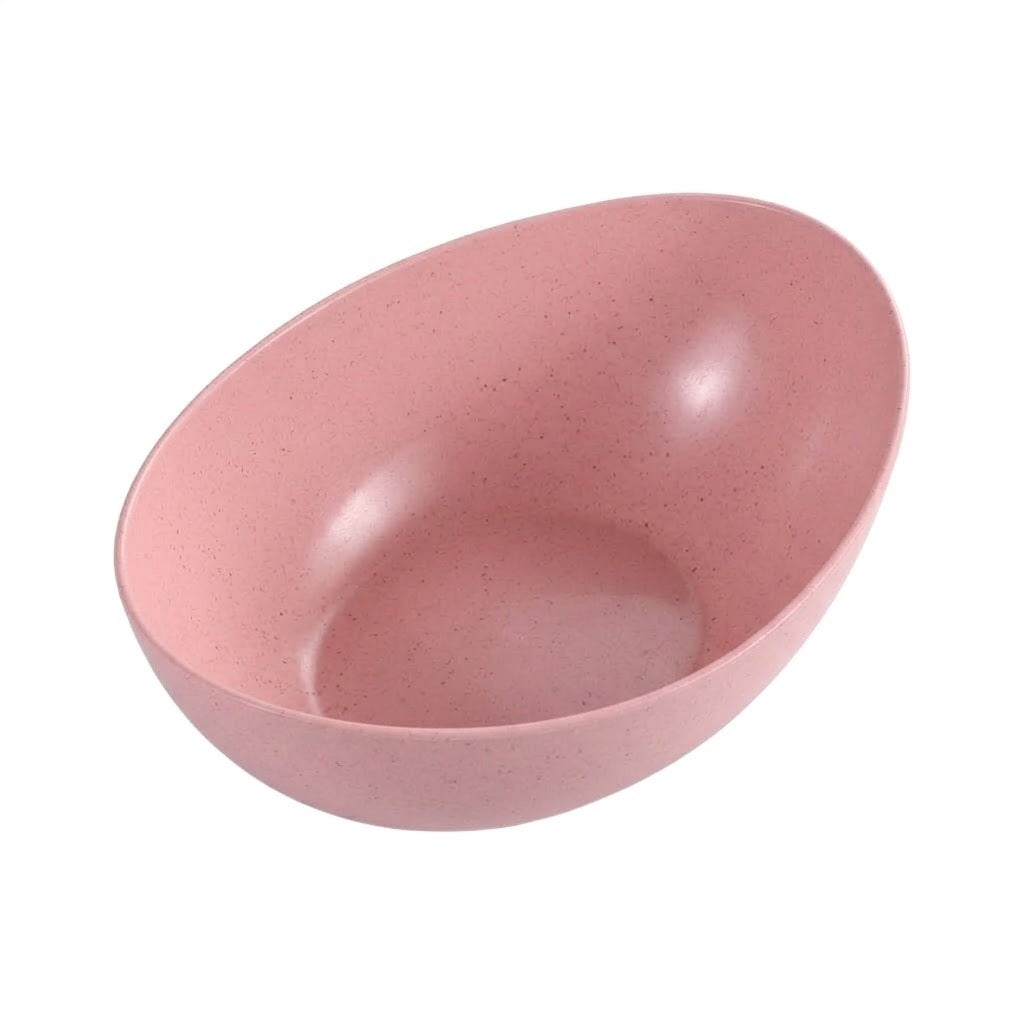 A pink speckled bowl with a smooth, matte finish, photographed from an elevated angle against a solid white background.