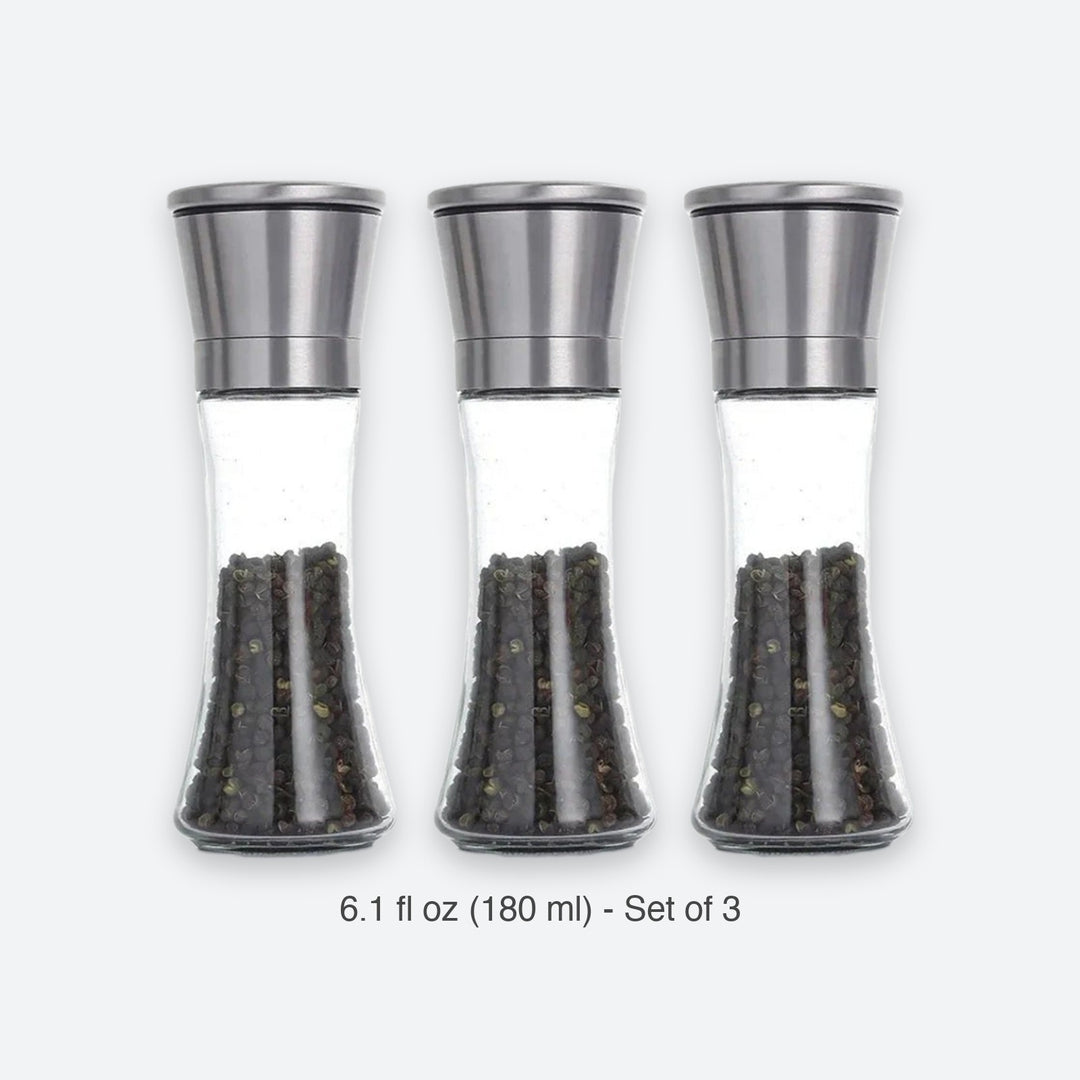 Three clear glass pepper mills with stainless steel tops, shown side by side on a light gray background with the text '6.1 fl oz (180 ml) - 1 Piece' below.