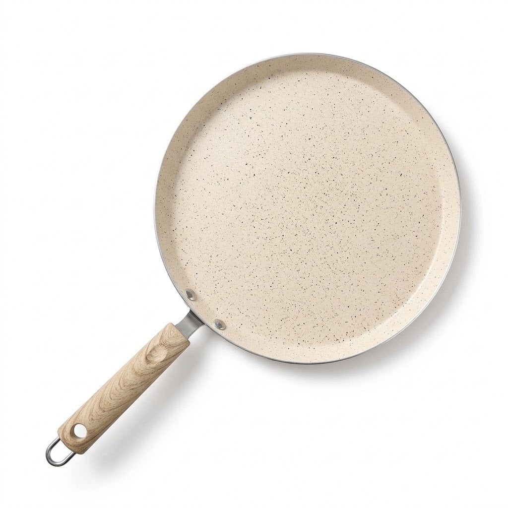 A round non-stick frying pan with a speckled beige interior and a light wood handle, shown from an overhead angle on a white background.
