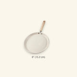 A 6-inch round frying pan with a light beige non-stick coating and a light wood handle, shown against a solid cream background with a size label below.