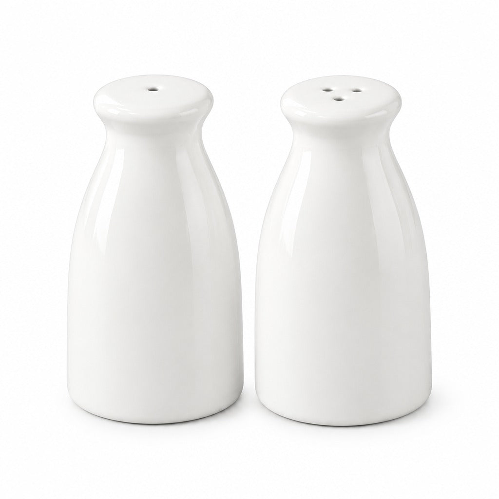 A pair of glossy white ceramic salt and pepper shakers with a milk bottle design, shown on a seamless white background.