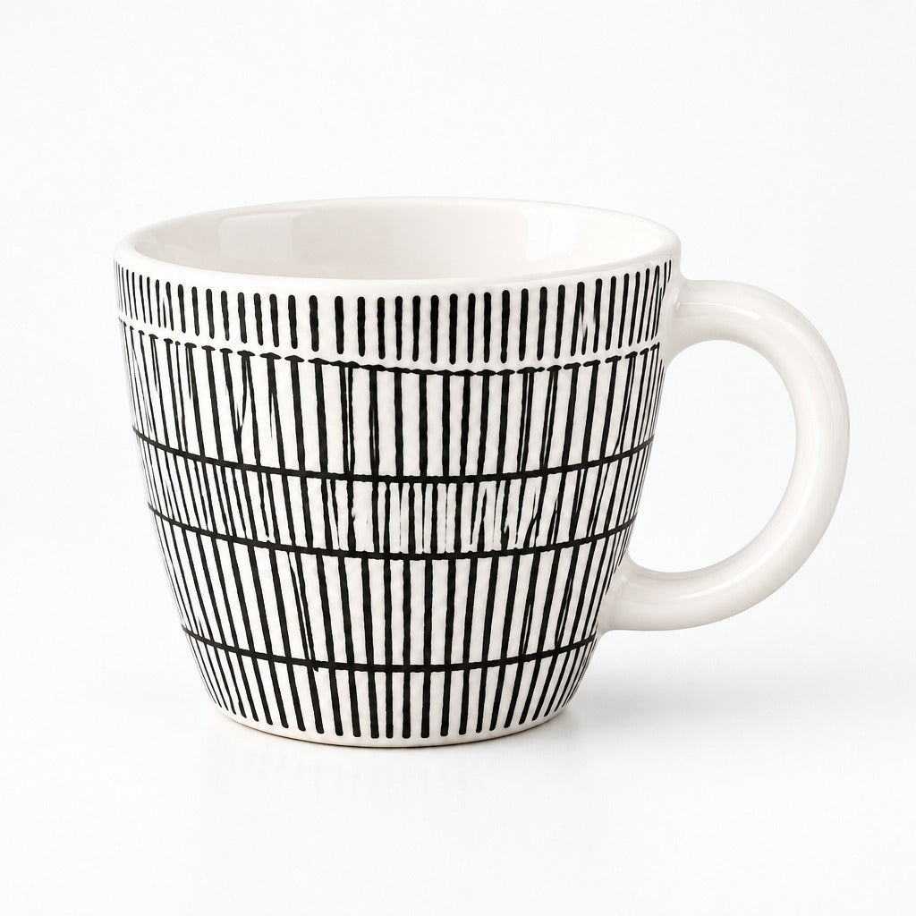 A white ceramic mug with a black hand-drawn vertical stripe pattern, shown on a clean white background.