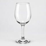 A clear stemmed wine glass with a wide bowl, shown on a light gray studio background.