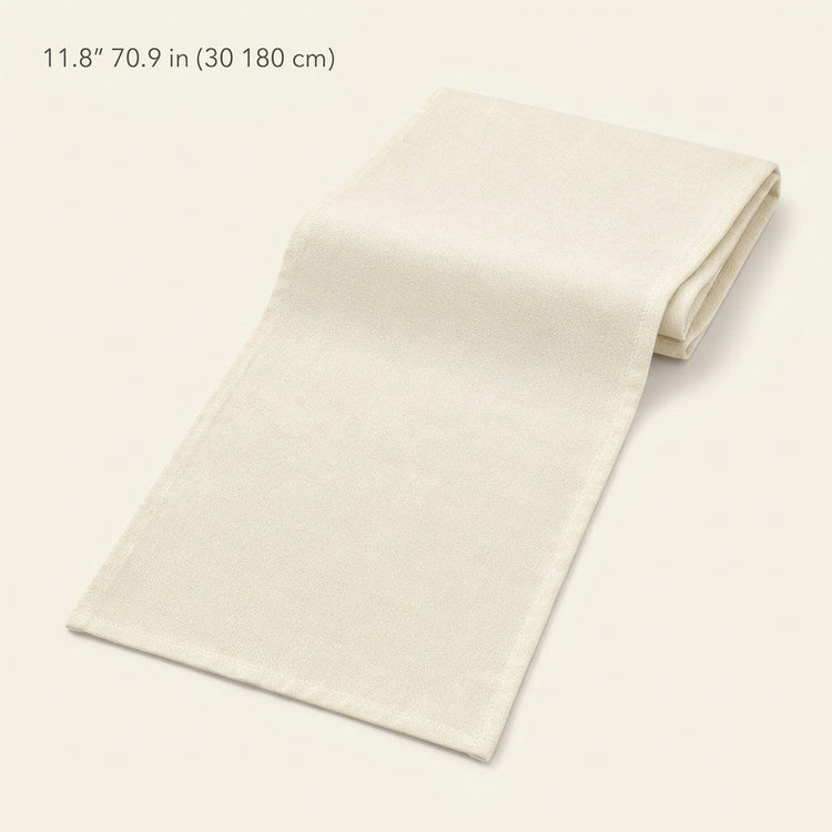 An off-white woven fabric napkin or table linen, folded and displayed diagonally on a matching light cream background, with text in the top-left corner reading '11.8" 70.