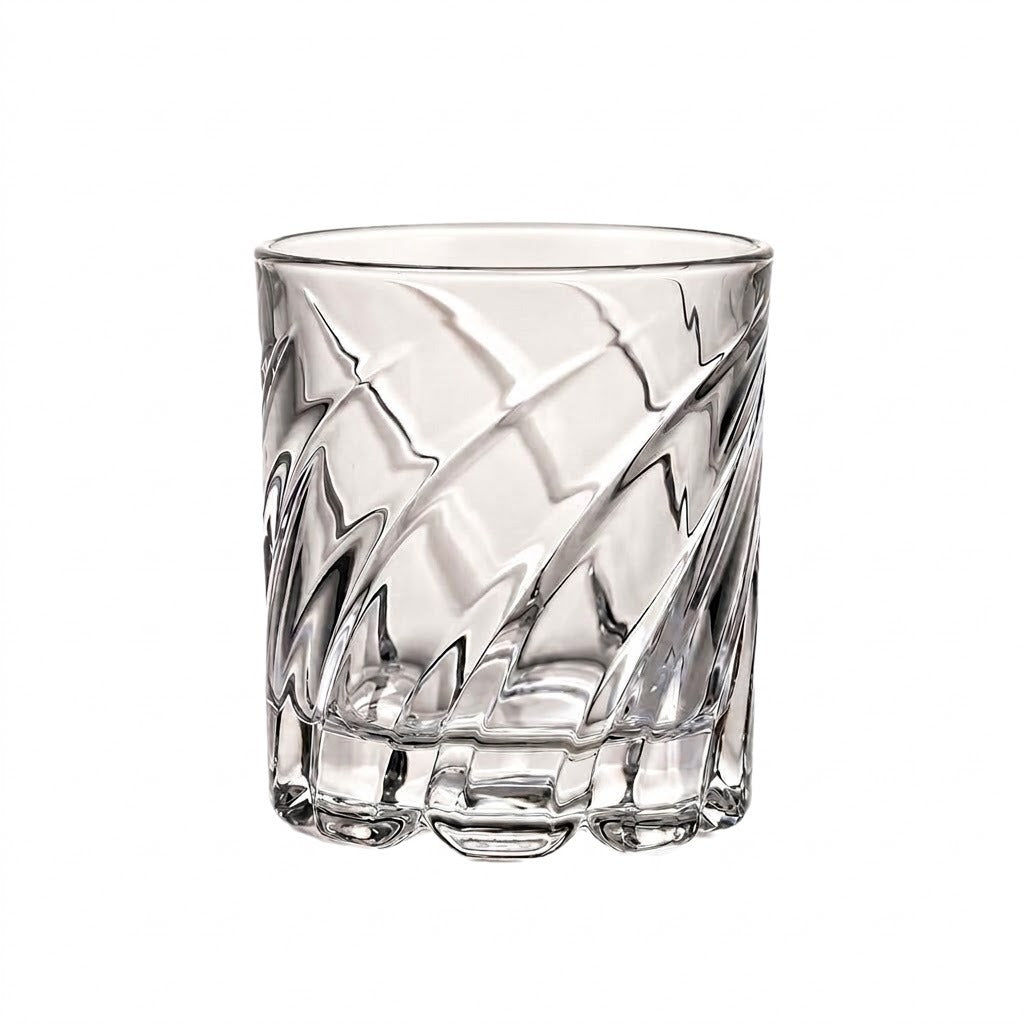 A clear cut-glass tumbler with a textured, faceted pattern, shown on a solid white background.