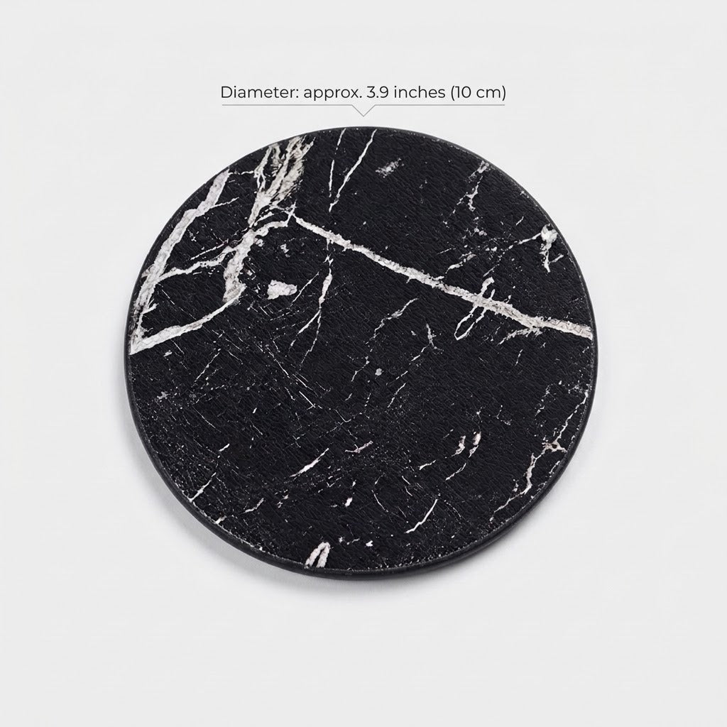 A round black marble coaster with white veining, shown on a light gray background with a text overlay indicating its diameter is approximately 3.9 inches (10 cm).