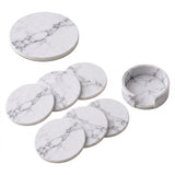 A set of round white marble-patterned coasters and a matching small cup or holder, shown on a clean white background.