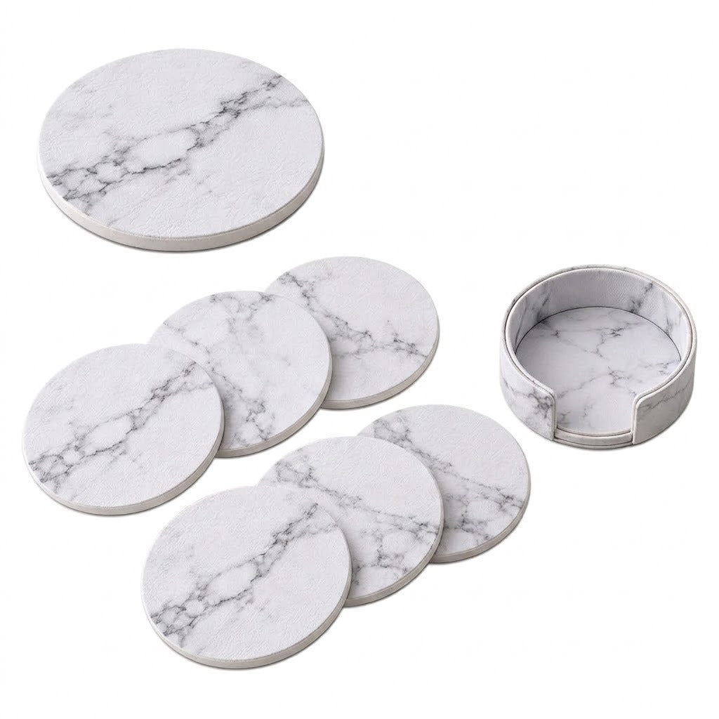 A set of round white marble-patterned coasters and a matching small cup or holder, shown on a clean white background.