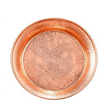 A round hammered copper tray or shallow dish with a textured metallic finish, shown from a top-down view on a plain white background.