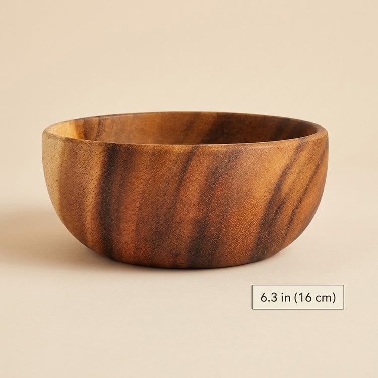 A round wooden bowl with a rich brown and amber wood grain pattern, shown on a neutral beige background with a size label indicating 6.3 in (16 cm) diameter.