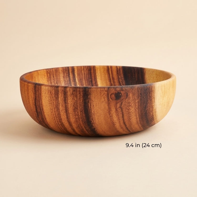 A round wooden bowl with a rich brown and golden wood grain pattern, shown on a neutral beige background with a size measurement overlay of 9.4 in (24 cm) at the bottom right.
