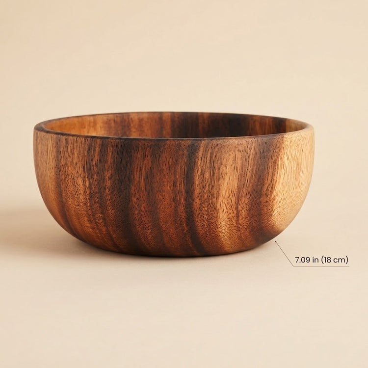 A round wooden bowl with a rich brown wood grain pattern, shown on a neutral beige background with a size indicator label reading 7.09 in (18 cm) on the right side.