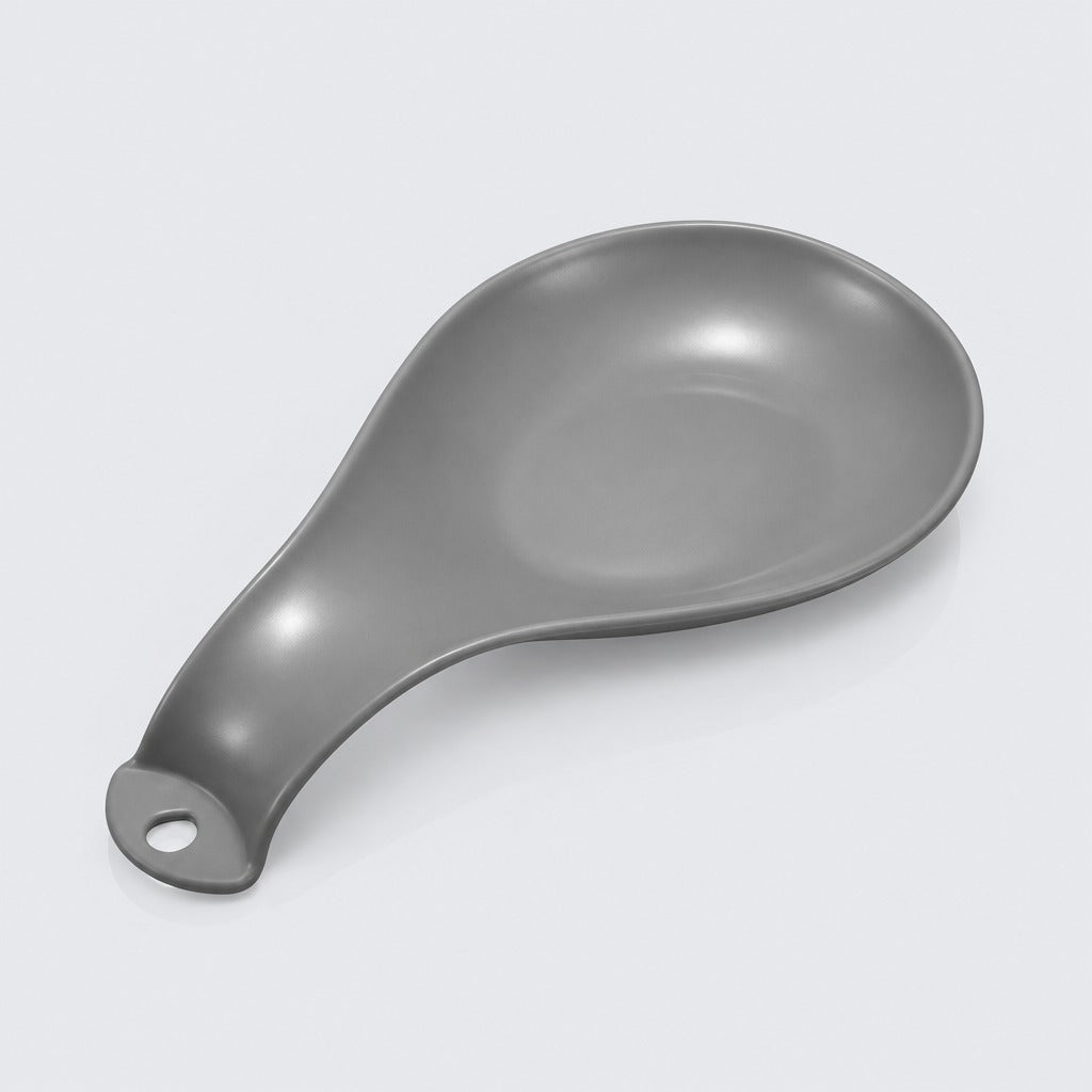 White plastic spoon rest with a decorative swirl design shown alone on a plain light background.