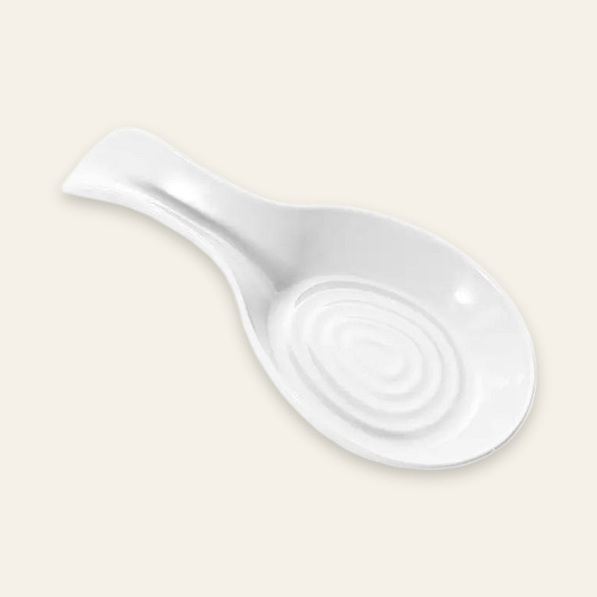 A white ceramic spoon rest with a spiral pattern in the center and a handle on the left, shown on a solid light beige background.