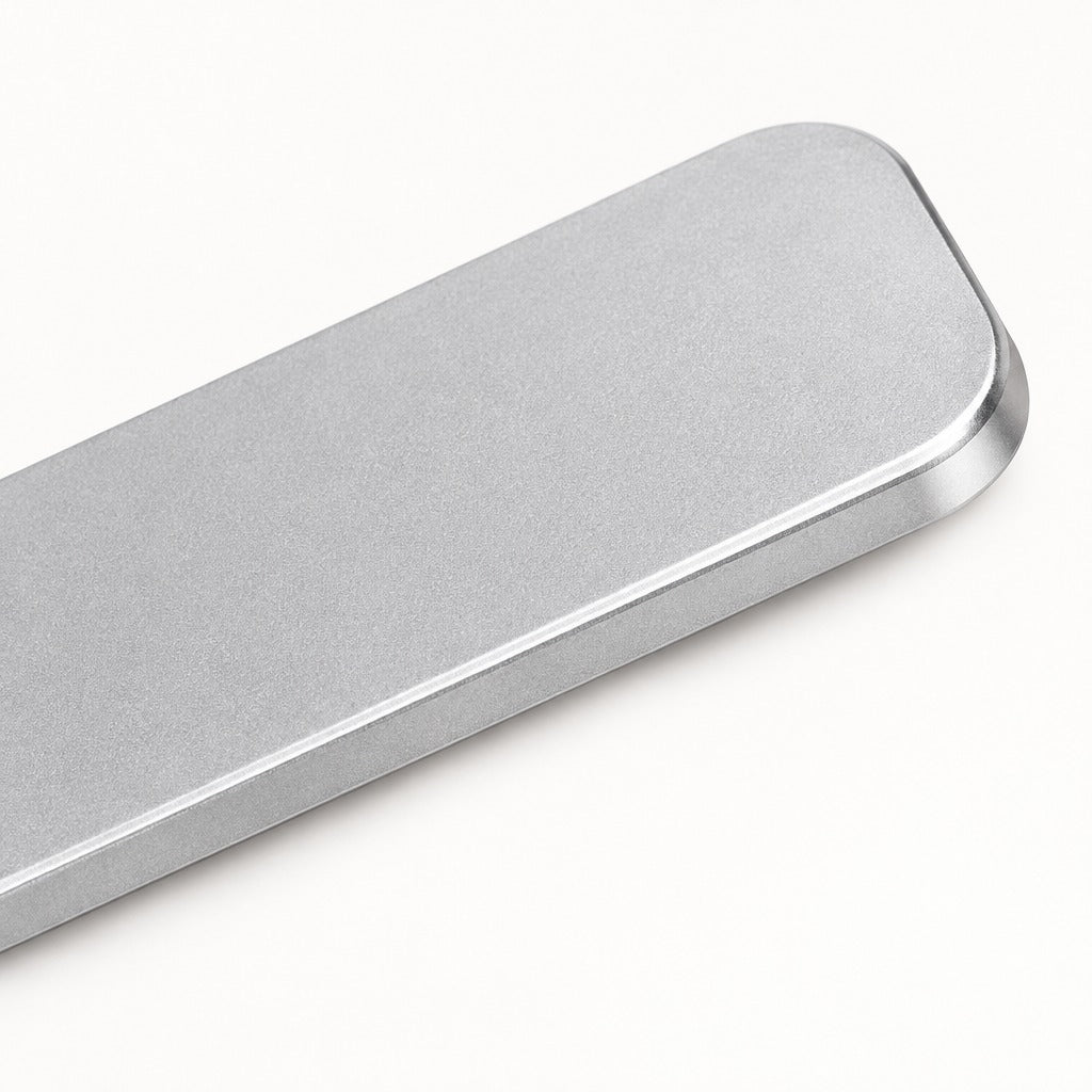A close-up of a brushed silver metal bar with rounded corners, shown diagonally on a clean white background.