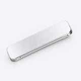 A slim, rectangular silver metal case with rounded corners, shown at an angle on a clean white background.