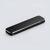Black folding cot on a white background