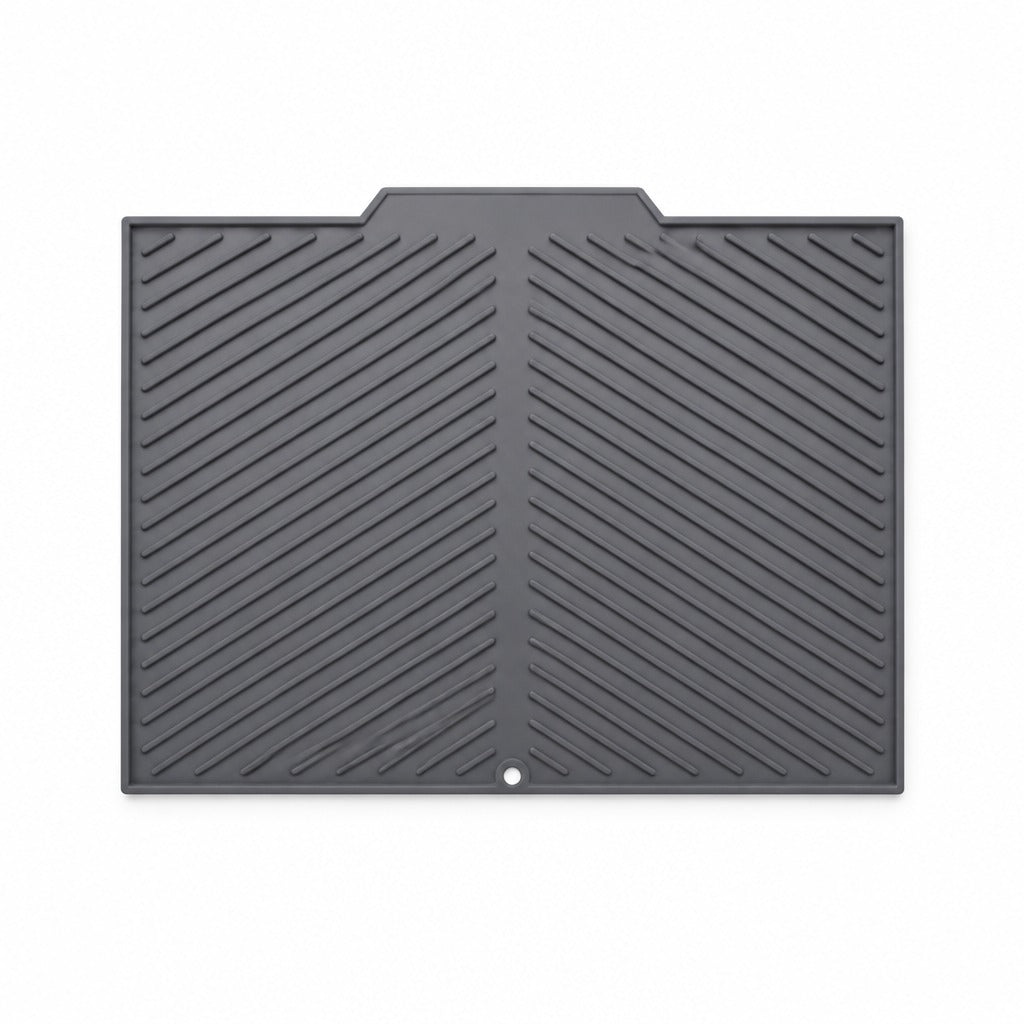 A dark gray rubber utility mat with a textured diagonal grooved pattern and a small circular hole near the bottom center, shown on a plain white background.