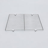 A rectangular stainless steel wire cooling rack with horizontal bars and four small feet at the bottom, photographed on a clean light gray background.