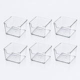 Six clear square storage bins with lowered front openings arranged in two rows of three on a white background.