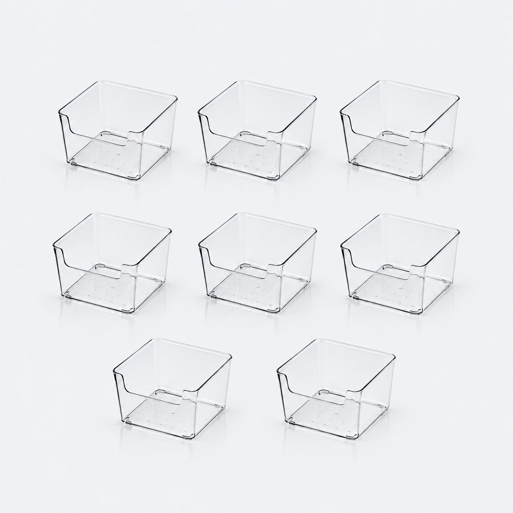 Eight clear plastic organizer bins arranged in two rows on a clean white background.