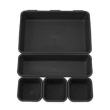 Set of black plastic trays on a white background