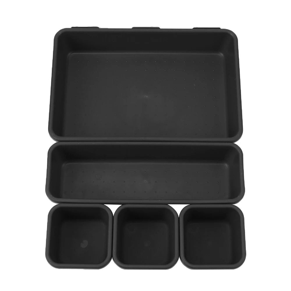 Set of black plastic trays on a white background