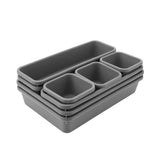 A set of five gray plastic storage containers with nested compartments, arranged in a stack on a plain white background.