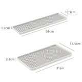 Two rectangular white perforated trays shown on a light gray background with dimension labels and measurements: one 38cm by 10.5cm by 1.