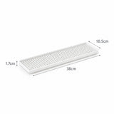A white rectangular tray with a perforated top surface, shown on a white background with dimension labels indicating 38cm length, 10.5cm width, and 1.