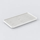 A rectangular white plastic tray with a perforated grid pattern on the top, shown on a light gray background.