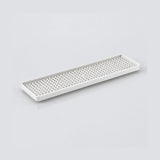 A long, rectangular white plastic tray with a perforated grid pattern on the bottom, shown on a clean light gray background.