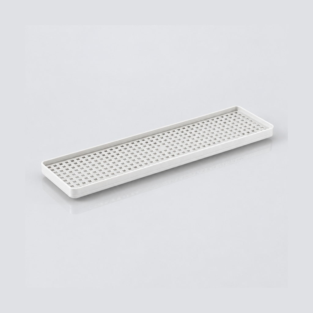 A long, rectangular white plastic tray with a perforated grid pattern on the bottom, shown on a clean light gray background.