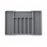 A gray plastic organizer tray with multiple compartments, shown from a top-down view on a white background.