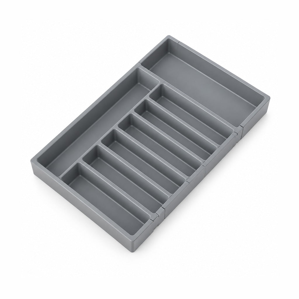 A gray plastic drawer organizer tray with multiple compartments, shown at an angle on a white background.