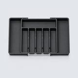 A black DNIs 0888 12Vdc to 220Vac power inverter, still inside its clear plastic packaging, shown on a white background.