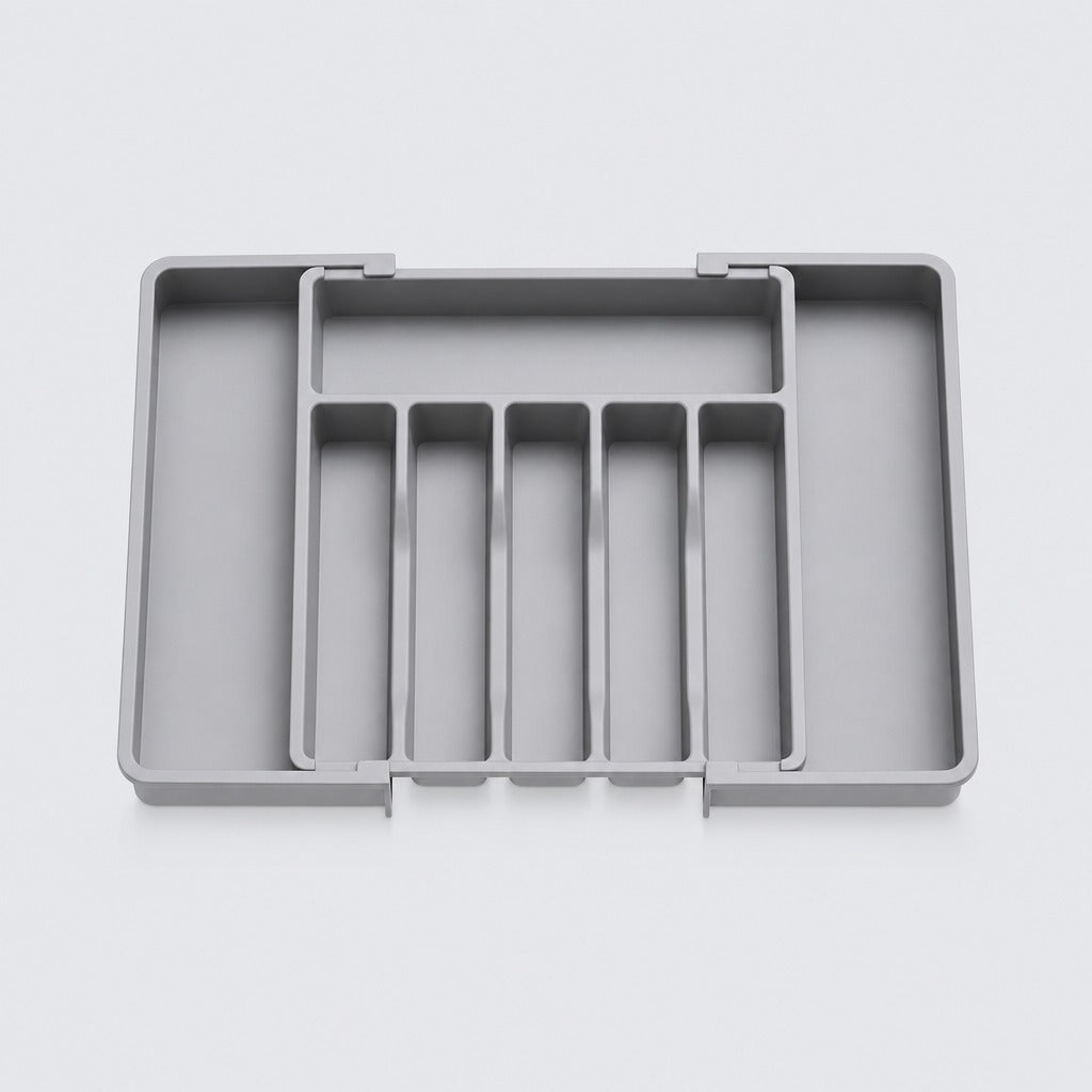 A gray plastic drawer organizer tray with five vertical divider slots and a larger compartment on the left, shown on a light gray background.
