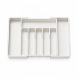 A white plastic organizer tray with multiple vertical compartments and a top divider, shown from a top-down view on a white background.