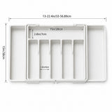 White plastic organizer tray with measurement annotations showing dimensions of 13-22.4in/33-56.