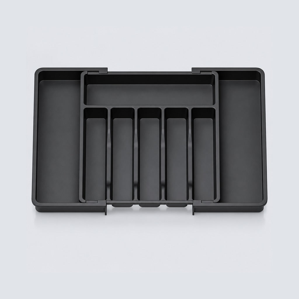 A black plastic cash organizer tray with multiple compartments, shown from a top-down view on a light gray background.