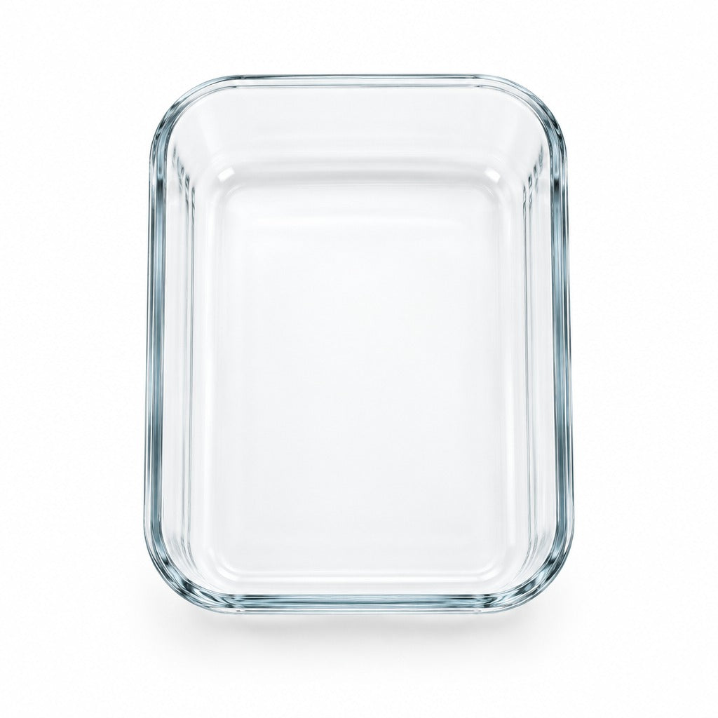 A clear rectangular glass baking dish with rounded corners and thick walls, shown from a top-down perspective on a white background.