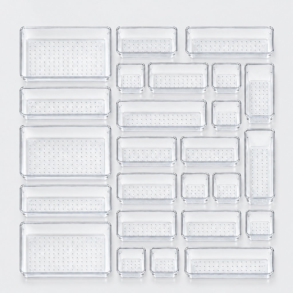 A set of clear plastic rectangular trays in multiple sizes, arranged in a grid on a light gray background.