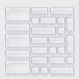 A set of clear plastic rectangular trays in multiple sizes, arranged in a grid on a light gray background.