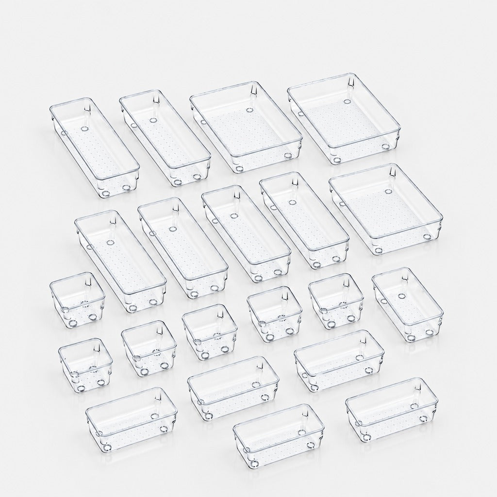 A set of clear plastic rectangular junction boxes in various sizes, arranged on a light gray background.