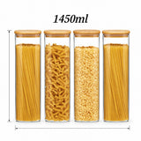 Four clear glass canisters with bamboo lids, filled with pasta and grains, shown on a white background with dimension lines and the text '1450ml' above.