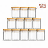 Twelve clear glass storage jars with light natural wood lids, arranged in a pyramid stack on a white background. A text overlay in the top right reads '14.