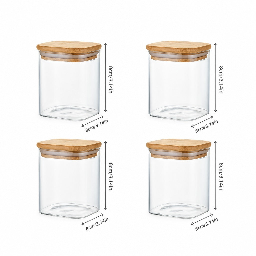 Four clear glass canisters with light brown bamboo lids, arranged in a 2x2 grid on a white background, each with dimension arrows and labels indicating 8cm height and 8cm width.