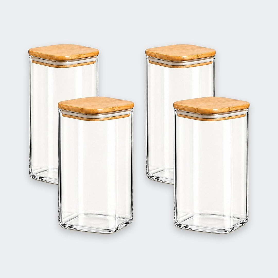 Four clear glass canisters with square bamboo wood lids, arranged in a two-by-two grid on a light gray background.